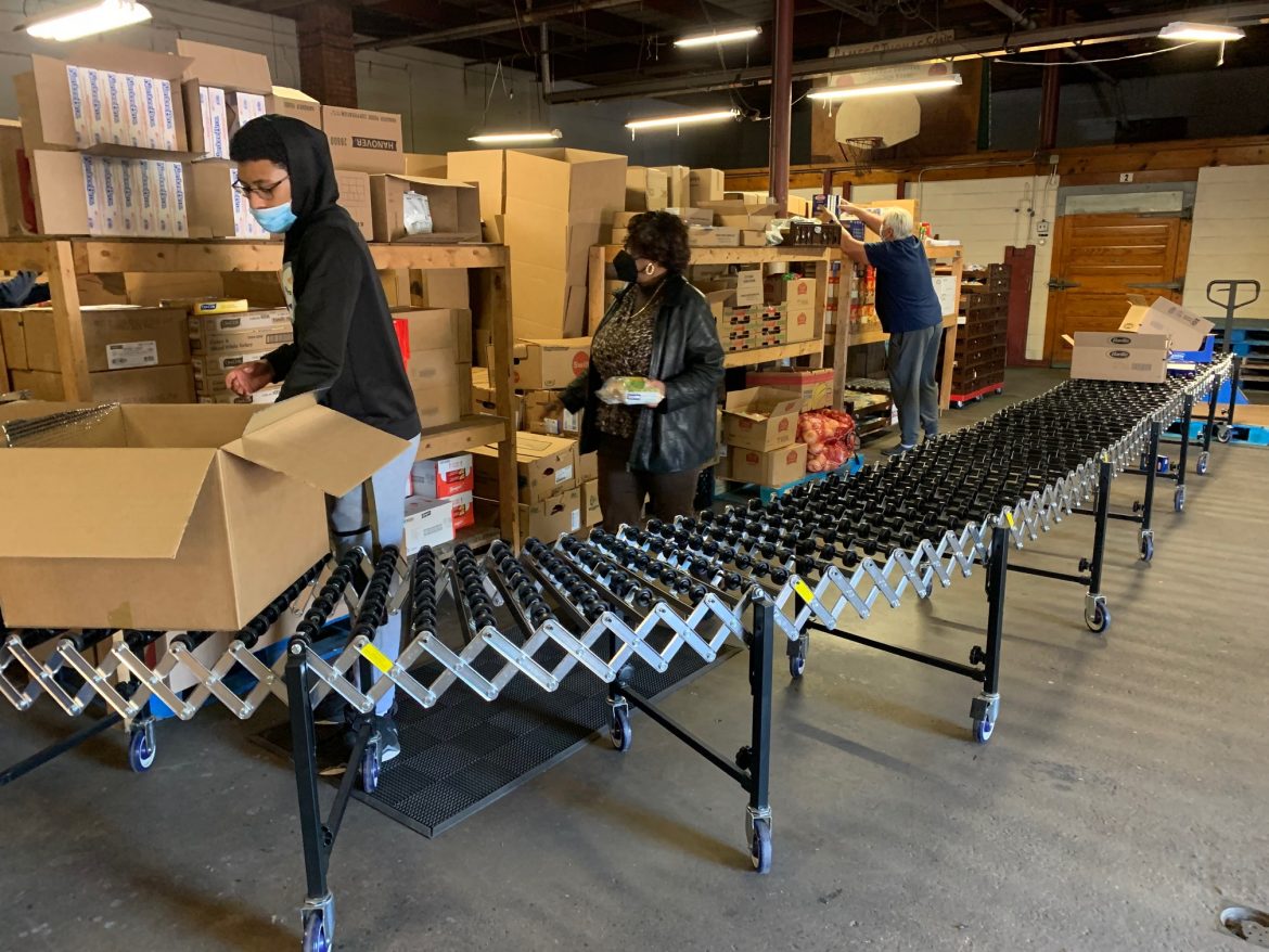 Boxes of food are prepared for the SHINE program families.