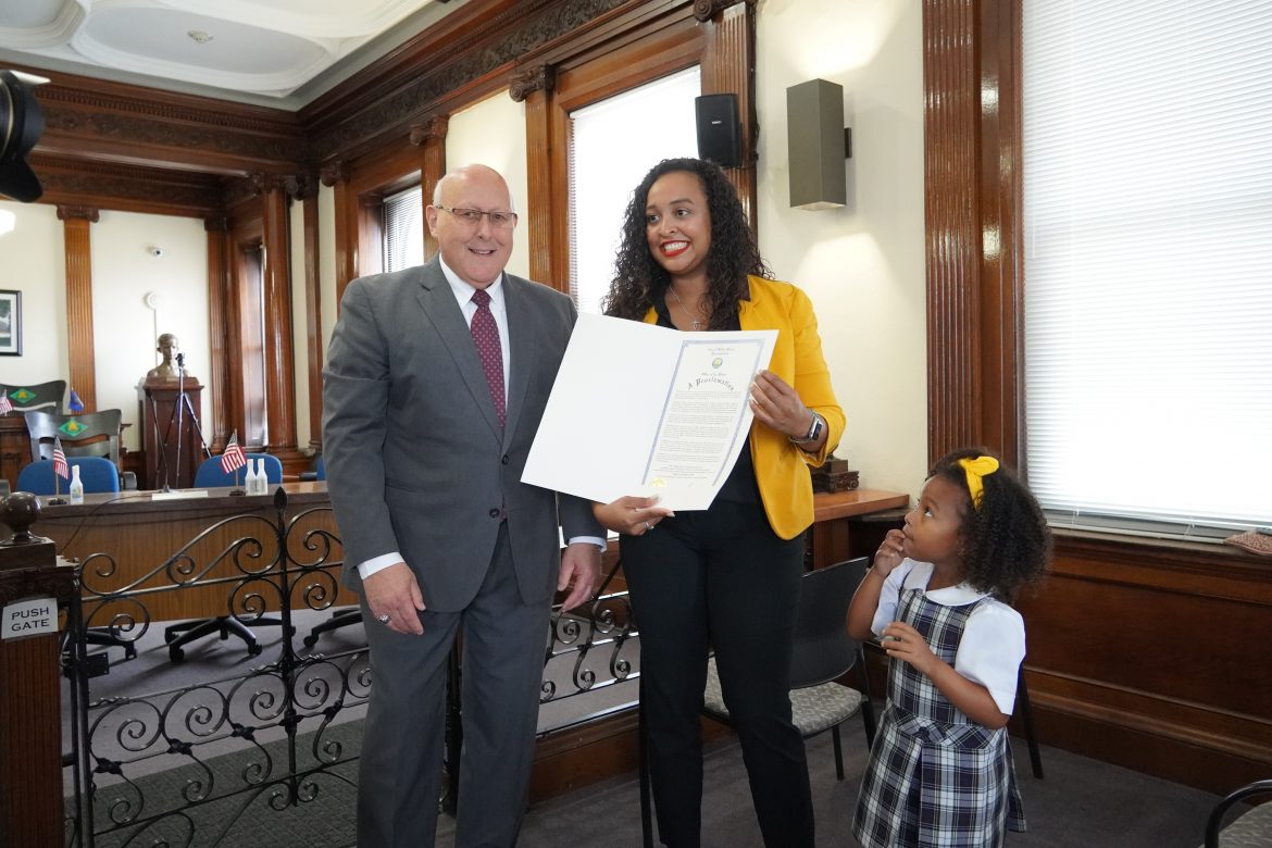 Erica Acosta receives the proclamation by Wilkes-Barre mayor George Brown announcing her as Marshal of the Multicultural Parade
