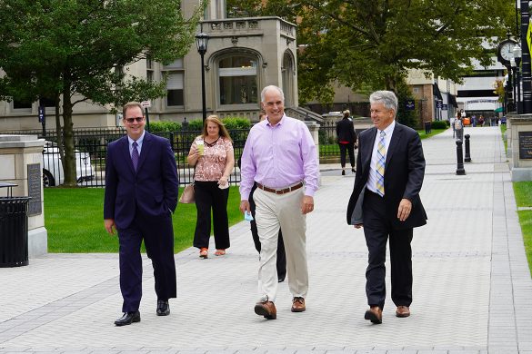 Senator Bob Casey walking the campus gateway during his visit on Sept. 16, 2021.