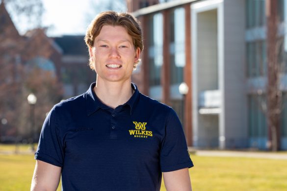 photo of jack perna taken with stark learning center in the background