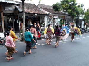 Bali women walking down a street