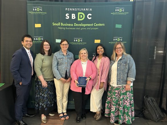 Group photo of SBDC staff with their award