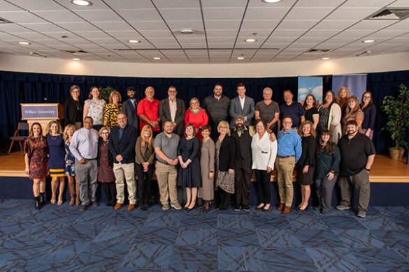 Wilkes employees posing for a group photo at the Annual Service Awards Dinner.