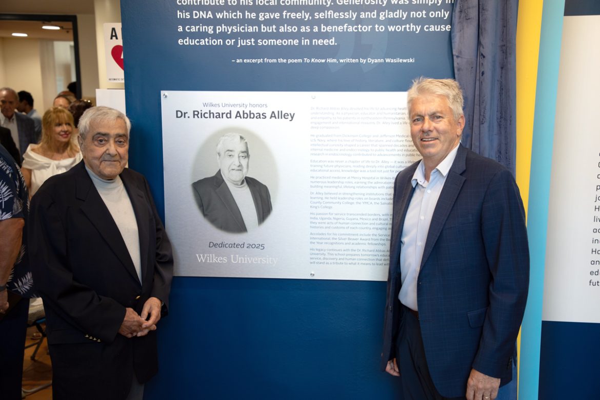 Dr. Alley and President Cant unveil a plaque at the dedication ceremony