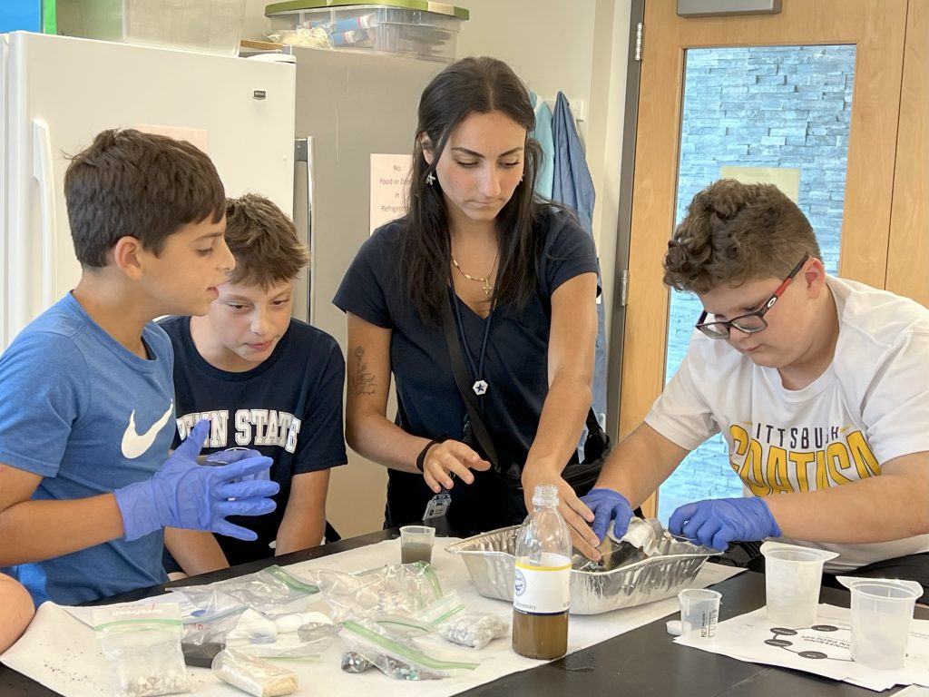 Alena Carabetta working with students on the Wilkes campus.