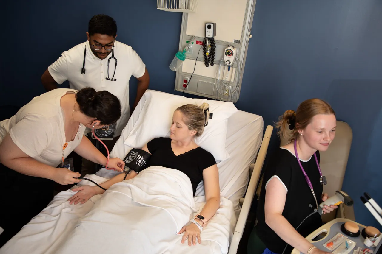 ABSN students at Wilkes University work in the clinical nursing simulation center